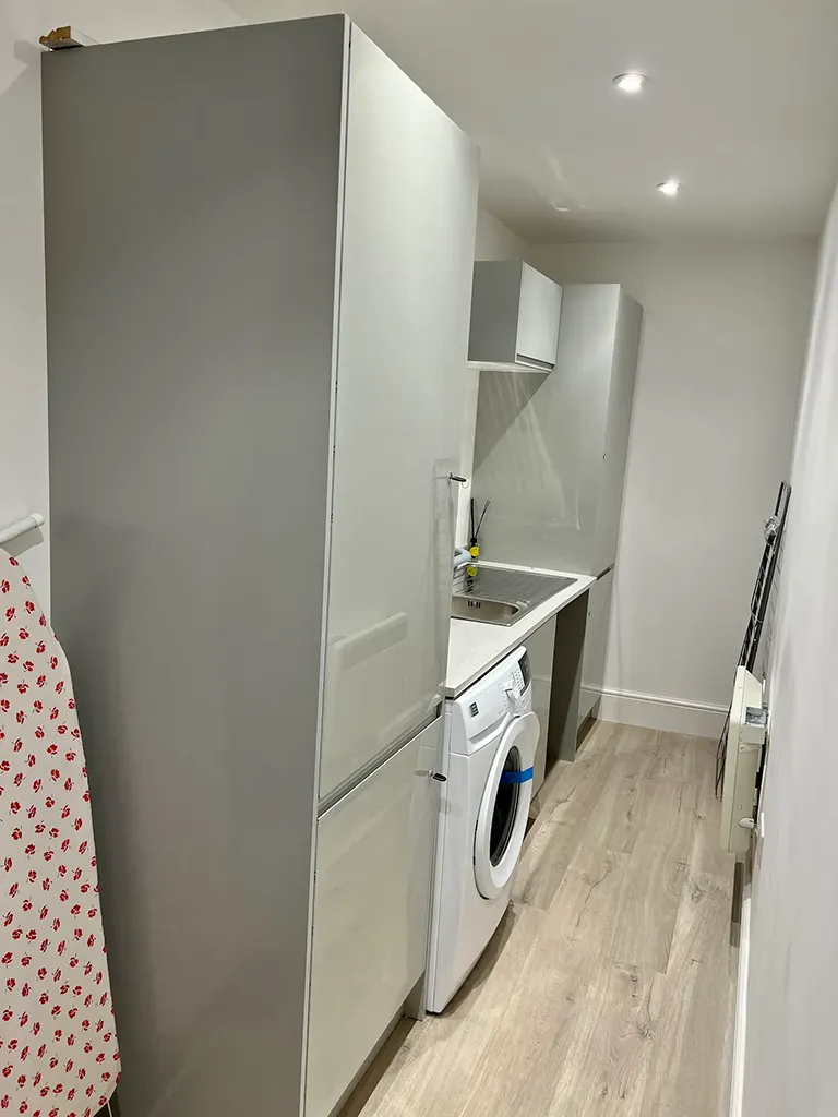 Utility room with washing machine